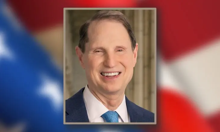 Official portrait of Senator Ron Wyden smiling in a suit.