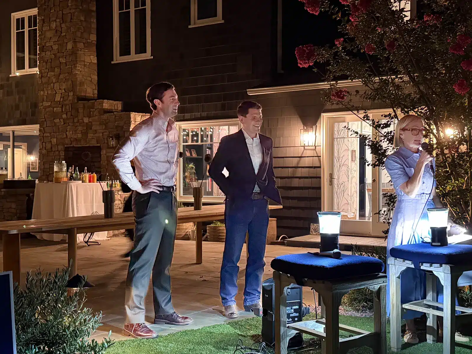 Jon Ossoff and James Talarico stand outdoors at an event in Brentwood, California.